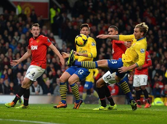 Nicklas Bendtner and Olivier Giroud of Arsenal with a last minute chance to equalise - Barclays Premier League - Manchester United (ManU) vs Arsenal FC London - Old Trafford Stadium - Manchester - England - 10 11 13 - EDITORIAL USE ONLY. No use with unauthorised audio, video, data, fixture lists, club league logos or live services. Online in-match use limited to 120 images, no video emulation. No use in betting, games or single club league player publications.
