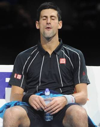 Tennis - 2013 ATP Tennis Herren World Tour Finals at The O2 - Day Seven Semi final - Novak Djokovic - Serbia meditates in between games 