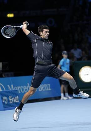 11.11.2013. O2 stadium, London, England. Novak Djokovic (SRB) with an overhead smash in his men s singles Final match during Final day of the Barclays ATP Tennis Herren World Tour Finals at The O2 Arena. during the Barclays ATP Tennis Herren World Tour Finals from the O2 Arena. xHongboxChenx  ActionPlus20155362