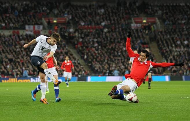 England s Adam Lallana fires in a shot - England v Chile - International Friendly - Wembley Stadium - London - England -15 11 2013 - Pic David Klein Sportimage EDITORIAL USE ONLY. No use with unauthorised audio, video, data, fixture lists, club league logos or live services. Online in-match use limited to 120 images, no video emulation. No use in betting, games or single club league player publications.