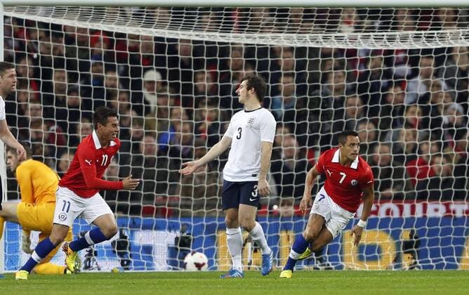 Chile s Alexis Sanchez celebrates scoring his sides opening goal - England v Chile - International Friendly - Wembley Stadium - London - England -15 11 2013 - Pic David Klein Sportimage EDITORIAL USE ONLY. No use with unauthorised audio, video, data, fixture lists, club league logos or live services. Online in-match use limited to 120 images, no video emulation. No use in betting, games or single club league player publications.