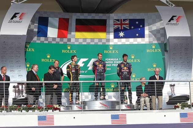 Nov. 17, 2013 - Austin, Texas, U.S - MARK WEBBER (2) driver of the Red Bull Racing Renault, SEBASTIAN VETTEL (1) driver of the Red Bull Racing Renault and ROMAIN GROSJEAN (8) driver of the Lotus F1 Team Renault stand on the winners podium after the Formula 1 United States Grand Prix race at the Circuit of the Americas race track in Austin,Texas. F1 2013 - United States Grand Prix .. - ZUMAw30