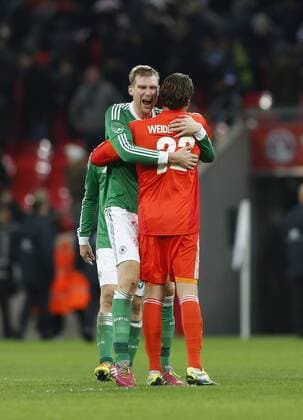 Germany s Per Mertesacker celebrates at the final whistle with goalkeeper Roman Weidenfeller England v Germany - International Friendly - Wembley England -19 11 2013 - Pic David Klein Sportimage EDITORIAL USE ONLY. No use with unauthorised audio, video, data, fixture lists, club league logos or live services. Online in-match use limited to 120 images, no video emulation. No use in betting, games or single club league player publications.