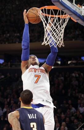 New York Knicks Carmelo Anthony shoots a lay up over Indiana Pacers George Hill in the first half at Madison Square Garden in New York City on November 20, 2013.  NYP20131120152