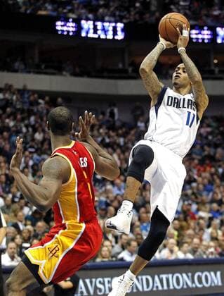Nov. 20, 2012 - Dallas, TX, USA - Dallas Mavericks shooting guard Monta Ellis (11) shoots over Houston Rockets power forward Terrence Jones (6) at the American Airlines Center in Dallas on Wednesday, Nov. 20, 2013. Rockets at Mavericks  - ZUMAver