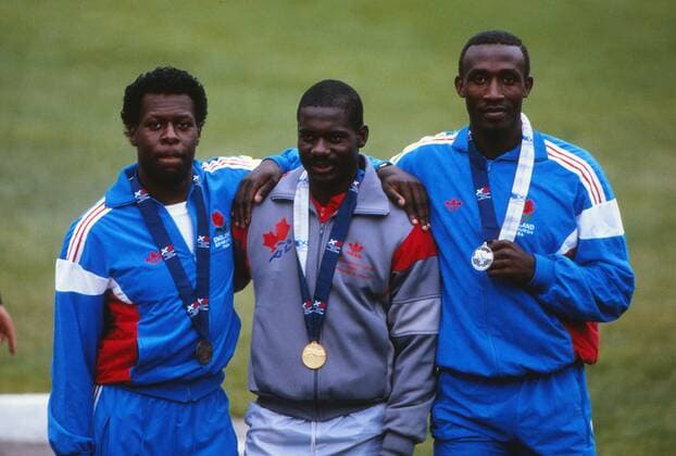 Athletics - 1986 Edinburgh Commonwealth Games - Men s 100m Medal Presentation Left to right: England s Mike McFarlane (bronze), Canada s Ben Johnson (gold) and England s Linford Christie (silver) at Meadowbank Stadium. 