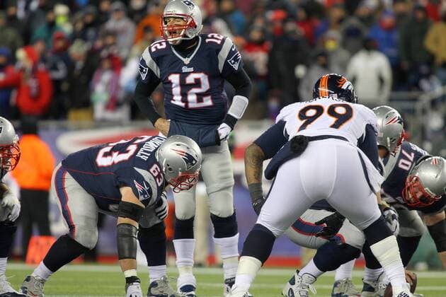 New England Patriots quarterback Tom Brady (12) calls an audible at the line of scrimmage in the third quarter against the Denver Broncos at Gillette Stadium in Foxboro, Massachusetts on November 24, 2013. The Patriots defeated the Broncos 34-31 in overtime.  BOS2013112416