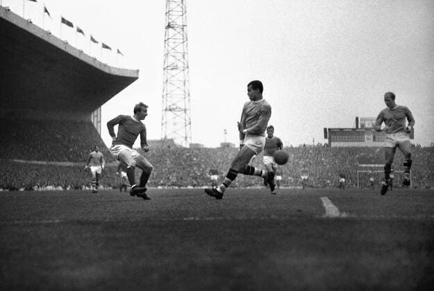 Football - 1966 1967 First Division - Manchester United 1 Manchester City 0 United s Denis Law, left, and City s Stan Horne, centre, at Old Trafford. 17 09 1966 