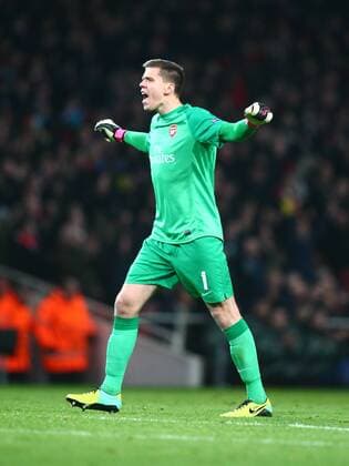 Arsenal s Wojciech Szczesny celebrates his team second goal Football - UEFA Champions League - Group F - 2nd Leg - Arsenal FC London v Olympique Marseille - 26th November 2013 - Emirates Stadium - London - UK MZE13_Arsenal_v_Marseille