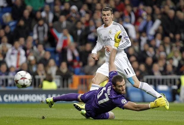 Soccer match between Real Madrid and Galatasaray Istanbul of the Champions League, held at the Santiago Bernabeu stadium, in Madrid 11 27 2013. Gareth Bale and Eray Iscan 