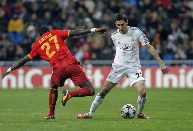 Soccer match between Real Madrid and Galatasaray Istanbul of the Champions League, held at the Santiago Bernabeu stadium, in Madrid 11 27 2013. Angel di Maria and Emmanuel Eboue 
