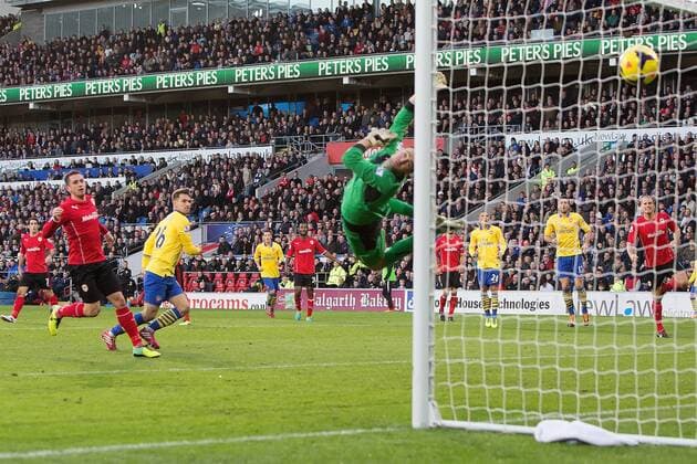 Arsenal s Aaron Ramsey scores the opening goal - Cardiff City vs. Arsenal FC London - Barclays Premier League - Cardiff City Stadium - Cardiff - 30 11 2013 EDITORIAL USE ONLY. No use with unauthorised audio, video, data, fixture lists, club league logos or live services. Online in-match use limited to 120 images, no video emulation. No use in betting, games or single club league player publications.