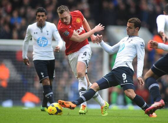 Football - 2013 2014 Premier League - Tottenham Hotspur vs. Manchester United (ManU) Roberto Soldado - tottenham Jonny Evans on the ball at White Hart Lane. 