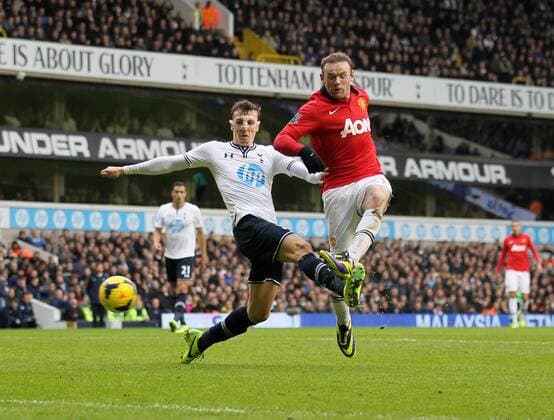 Tottenham s Vlad Chiriches tussles with Manchester United s Wayne Rooney Tottenham Hotspur v Manchester United - Premier League - White Hart Lane - London - 01 12 2013 - Pic David Klein Sportimage EDITORIAL USE ONLY. No use with unauthorised audio, video, data, fixture lists, club league logos or live services. Online in-match use limited to 120 images, no video emulation. No use in betting, games or single club league player publications.