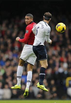 Tottenham s Vlad Chiriches tussles with Manchester United s Chris Smalling Tottenham Hotspur v Manchester United - Premier League - White Hart Lane - London - 01 12 2013 - Pic David Klein Sportimage EDITORIAL USE ONLY. No use with unauthorised audio, video, data, fixture lists, club league logos or live services. Online in-match use limited to 120 images, no video emulation. No use in betting, games or single club league player publications.