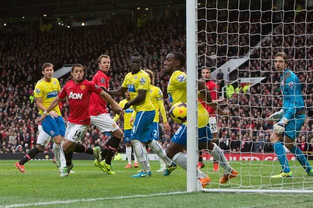 A header from Jonny Evans of Manchester United hits the post - Manchester United vs. Newcastle United - Barclays Premier League - Old Trafford - Manchester - 04 12 2013 Pic Philip Oldham Sportimage EDITORIAL USE ONLY. No use with unauthorised audio, video, data, fixture lists, club league logos or live services. Online in-match use limited to 120 images, no video emulation. No use in betting, games or single club league player publications.