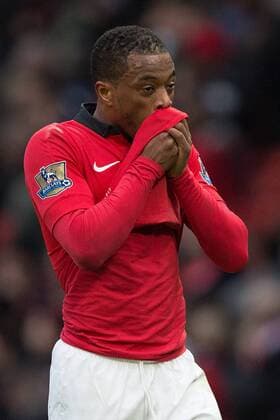 Patrice Evra of Manchester United looks dejected as he leaves the pitch following defeat - Manchester United vs. Newcastle United - Barclays Premier League - Old Trafford - Manchester - 04 12 2013 Pic Philip Oldham Sportimage EDITORIAL USE ONLY. No use with unauthorised audio, video, data, fixture lists, club league logos or live services. Online in-match use limited to 120 images, no video emulation. No use in betting, games or single club league player publications.