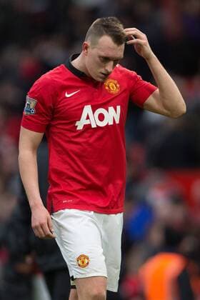 Phil Jones of Manchester United scratches his head as he leaves the pitch following defeat - Manchester United vs. Newcastle United - Barclays Premier League - Old Trafford - Manchester - 04 12 2013 Pic Philip Oldham Sportimage EDITORIAL USE ONLY. No use with unauthorised audio, video, data, fixture lists, club league logos or live services. Online in-match use limited to 120 images, no video emulation. No use in betting, games or single club league player publications.