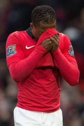 Patrice Evra of Manchester United looks dejected as he leaves the pitch following defeat - Manchester United vs. Newcastle United - Barclays Premier League - Old Trafford - Manchester - 04 12 2013 Pic Philip Oldham Sportimage EDITORIAL USE ONLY. No use with unauthorised audio, video, data, fixture lists, club league logos or live services. Online in-match use limited to 120 images, no video emulation. No use in betting, games or single club league player publications.