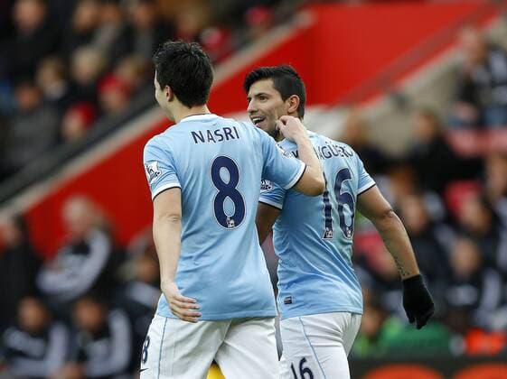 Manchester City s Sergio Kun Aguero celebrates scoring his sides opening goal with Samir Nasri by getting his cheek pinched Southampton v Manchester City - Premier League - St Mary s - Southampton - 07 12 2013 - Pic David Klein Sportimage EDITORIAL USE ONLY. No use with unauthorised audio, video, data, fixture lists, club league logos or live services. Online in-match use limited to 120 images, no video emulation. No use in betting, games or single club league player publications.