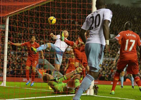 James Collins of West Ham United turns the ball into his own net for the second goal - Barclays Premier League - Liverpool vs West Ham Utd - Anfield Stadium - Liverpool - England - 7th December 2013 - Picture Simon Bellis Sportimage EDITORIAL USE ONLY. No use with unauthorised audio, video, data, fixture lists, club league logos or live services. Online in-match use limited to 120 images, no video emulation. No use in betting, games or single club league player publications.