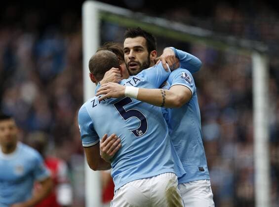 Manchester City s Alvaro Negredo celebrates scoring his sides second goal Manchester City vs Arsenal - Premier League - Etihad Stadium - Manchester - England - 14 12 2013 - Pic David Klein Sportimage EDITORIAL USE ONLY. No use with unauthorised audio, video, data, fixture lists, club league logos or live services. Online in-match use limited to 120 images, no video emulation. No use in betting, games or single club league player publications.