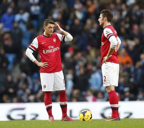 Arsenal s Mesut Ozil and Olivier Giroud look on dejected after going 4-2 down Manchester City vs Arsenal - Premier League - Etihad Stadium - Manchester - England - 14 12 2013 - Pic David Klein Sportimage EDITORIAL USE ONLY. No use with unauthorised audio, video, data, fixture lists, club league logos or live services. Online in-match use limited to 120 images, no video emulation. No use in betting, games or single club league player publications.