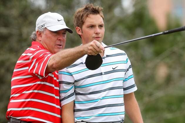 14 DEC 2013: Lanny Wadkins points out where to aim to his son, Tucker, during the first round of the PNC Father-Son Challenge at The Ritz-Carlton Golf Club in Orlando, Florida. GOLF: DEC 14 PNC Father-Son Challenge - 1st Round Icon357131214288 EDITORIAL USE ONLY