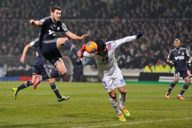 Milan Bisevac (lyon) vs Andre Pierre Gignac (marseille) FOOTBALL : Olympique Lyon vs Olympique Marseille - Ligue 1 - 15 12 2013 FredericChambert Panoramic 