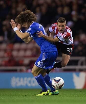 Emanuele Giaccherini of Sunderland collides with David Luiz of Chelsea - Sunderland vs. Chelsea - Capital One League Cup - Stadium of Light - Sunderland - 17 12 2013 Pic Philip Oldham Sportimage EDITORIAL USE ONLY. No use with unauthorised audio, video, data, fixture lists, club league logos or live services. Online in-match use limited to 120 images, no video emulation. No use in betting, games or single club league player publications.