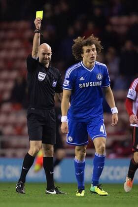 Referee Anthony Taylor shows David Luiz of Chelsea a yellow card - Sunderland vs. Chelsea - Capital One League Cup - Stadium of Light - Sunderland - 17 12 2013 Pic Philip Oldham Sportimage EDITORIAL USE ONLY. No use with unauthorised audio, video, data, fixture lists, club league logos or live services. Online in-match use limited to 120 images, no video emulation. No use in betting, games or single club league player publications.