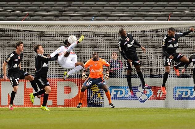 Bakary Kone (lyon) vs Johny Placide (reims) FOOTBALL : Olympique Lyon vs. Stade Reims - Coupe de la ligue - 18 12 2013 FredericChambert Panoramic 