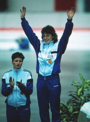 Speed Skating - 1988 Calgary Winter Olympics - Women s 1000m Medal Presentation East Germany s gold medal winner Christa Rothenburger Luding (gold), with compatriot Karin Enke-Kania, who won the silver, at the Olympic Oval, Calgary, Canada. Rothenburger won the gold medal in a new World Record, she also won a silver medal in the 500m. Later that year Rothenburger won a silver medal in sprint cycling at the Seoul Olympics, becoming the first woman to win medals in both the Winter and Summer Olympics. 26 02 1988 