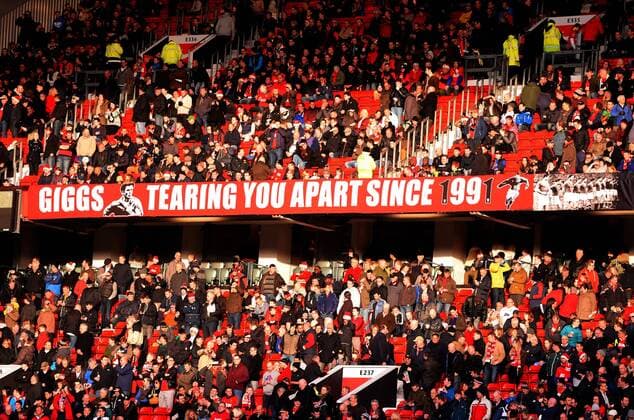 Banner in homage to Ryan Giggs - Barclays Premier League - Manchester Utd (ManU) - Old Trafford Stadium - Manchester - England - 21st December 2013 - EDITORIAL USE ONLY. No use with unauthorised audio, video, data, fixture lists, club league logos or live services. Online in-match use limited to 120 images, no video emulation. No use in betting, games or single club league player publications.