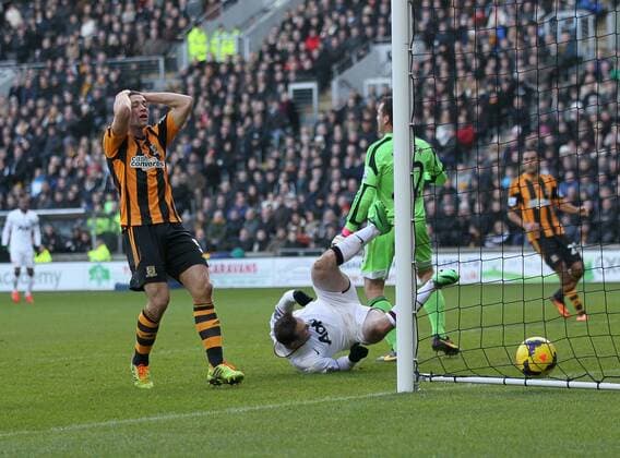 Hull City s James Chester looks on dejected after scoring an own goal to put Manchester United 3-2 up Hull City vs Manchester United - Premier League - KC Stadium - London - England - 26 12 2013 - Pic David Klein Sportimage EDITORIAL USE ONLY. No use with unauthorised audio, video, data, fixture lists, club league logos or live services. Online in-match use limited to 120 images, no video emulation. No use in betting, games or single club league player publications.