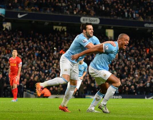 Vincent Kompany of Manchester City celebrates the equalising goal - Barclays Premier League - Manchester City vs Liverpool - Etihad Stadium - Manchester - England - 26th December 2013 - Picture Simon Bellis Sportimage EDITORIAL USE ONLY. No use with unauthorised audio, video, data, fixture lists, club league logos or live services. Online in-match use limited to 120 images, no video emulation. No use in betting, games or single club league player publications.