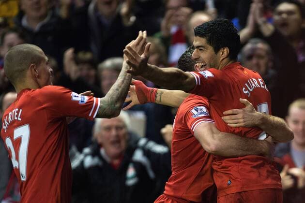 Luis Suarez of Liverpool celebrates scoring his sides second goal - Liverpool vs. Hull City - Barclays Premier League - Anfield - Liverpool - 01 01 2014 Pic Philip Oldham Sportimage EDITORIAL USE ONLY. No use with unauthorised audio, video, data, fixture lists, club league logos or live services. Online in-match use limited to 120 images, no video emulation. No use in betting, games or single club league player publications.