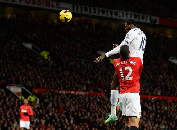 Emmanuel Adebayor of Tottenham scores with a header - Barclays Premier League - Manchester Utd vs Tottenham - Old Trafford Stadium - Manchester - England - 1st January 2014 - Picture Simon Bellis Sportimage EDITORIAL USE ONLY. No use with unauthorised audio, video, data, fixture lists, club league logos or live services. Online in-match use limited to 120 images, no video emulation. No use in betting, games or single club league player publications.