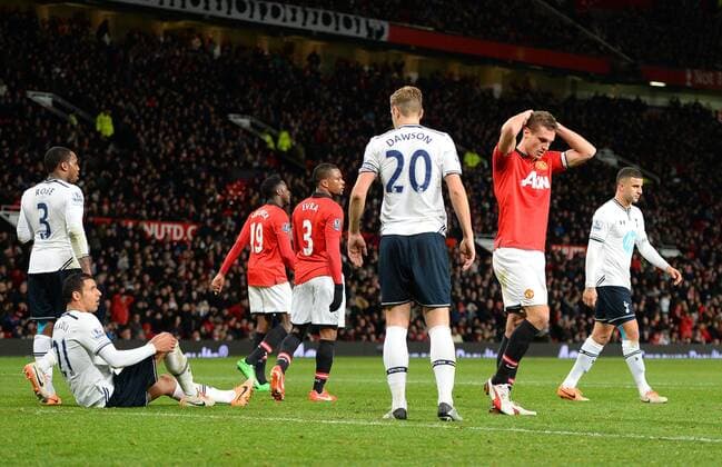 Dejection for Nemanja Vidic of Manchester United as a header goes over in the last minutes - Barclays Premier League - Manchester Utd vs Tottenham - Old Trafford Stadium - Manchester - England - 1st January 2014 - Picture Simon Bellis Sportimage EDITORIAL USE ONLY. No use with unauthorised audio, video, data, fixture lists, club league logos or live services. Online in-match use limited to 120 images, no video emulation. No use in betting, games or single club league player publications.