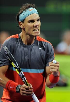 Rafael Nadal of Spain reacts during the men s singles final in Qatar Open tennis tournament, Jan. 4, 2014. Nadal won 2-1 to claim the champion. (Xinhua Chen Shaojin) (SP)QATAR-DOHA-TENNIS-MEN 