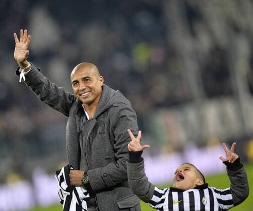 Former Juventus player David Trezeguet and son Noraan waves to the fans.Torino 05-01-2014 Juventus Stadium - Football Calcio Serie A 2013 2014 Juventus Turin vs AS Rom andreaxstaccioli