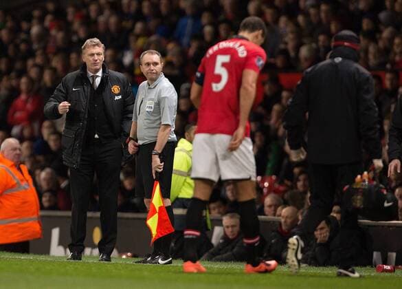 David Moyes, manager of Manchester United watches on as Rio Ferdinand of Manchester United limps off injured - Manchester United (ManU) vs. Swansea City - FA Cup Third Round - Old Trafford - Manchester - 05 01 2014 EDITORIAL USE ONLY. No use with unauthorised audio, video, data, fixture lists, club league logos or live services. Online in-match use limited to 120 images, no video emulation. No use in betting, games or single club league player publications.