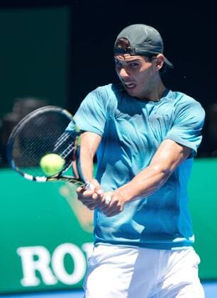 Rafael Nadal of Spain returns the ball during a training session for the Australia Open tennis tournament in Melbourne, Australia, Jan. 8, 2014. (Xinhua Bai Xue) (SP)AUSTRALIA-MELBOURNE-TENNIS-AUSTRALIA OPEN-TRAINING 