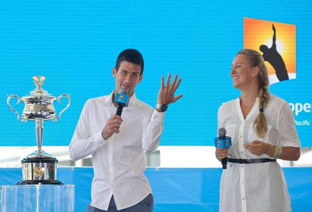 Defending champions Victoria Azarenka (R) of Belarus and Novak Djokovic of Serbia speak during the official draw of Australian Open tennis championship in Melbourne, Australia, Jan. 10, 2014. (Xinhua Bai Xue) (SP)AUSTRALIA-MELBOURNE-TENNIS-AUSTRALIA OPEN-DRAW 