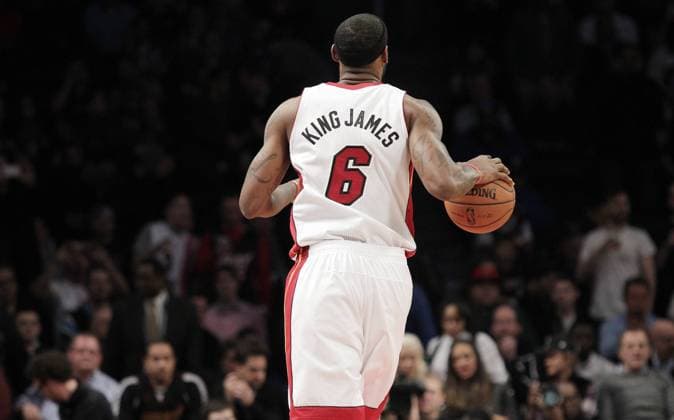Miami Heat LeBron James takes the ball up the court in the half against the Brooklyn Nets at Barclays Center in New York City on January 10, 2014. The Nets defeated the Heat 104-95 in double overtime.  NYP20140110115