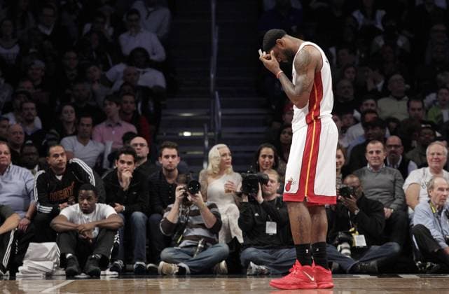 Miami Heat LeBron James stands on the court in the second half against the Brooklyn Nets at Barclays Center in New York City on January 10, 2014. The Nets defeated the Heat 104-95 in double overtime.  NYP20140110107