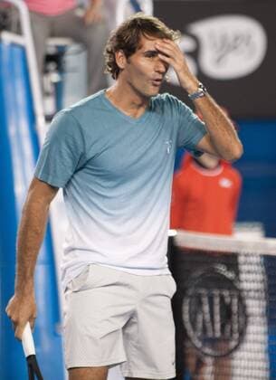 (140111) -- MELBOURNE, Jan. 11, 2014 (Xinhua) -- Roger Federer of Switzerland reacts during the Kids Day exhibition match ahead of the Australian Open tennis tournament in Melbourne, Australia, Jan. 11, 2014. (Xinhua Bai Xue) (SP)AUSTRALIA-MELBOURNE-TENNIS 