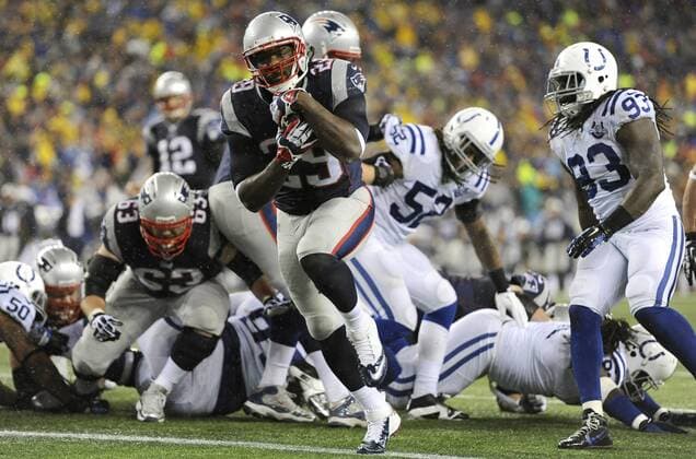New England Patriots running back LeGarrette Blount (29) charges into the end zone on a two-yard carry in the first quarter against the Indianapolis Colts in the AFC Divisional Playoff game at Gillette Stadium in Foxboro, Massachusetts on January 11, 2014. The Patriots defeated the Colts 43-22.  BOS2014011112