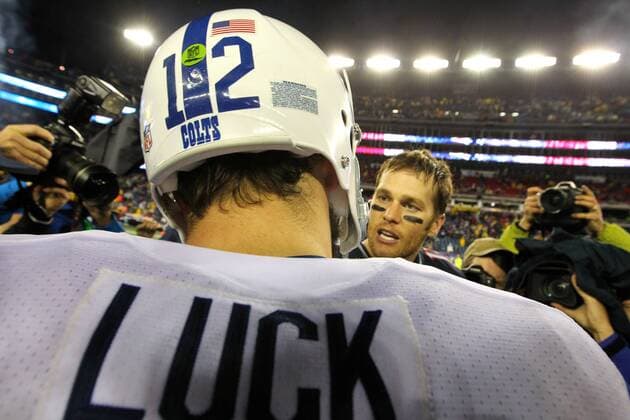 Indianapolis Colts quarterback Andrew Luck (12) shakes hands with New England Patriots quarterback Tom Brady (12) at the end of the AFC Divisional Playoff game at Gillette Stadium in Foxboro, Massachusetts on January 11, 2014. The Patriots defeated the Colts 43-22.  BOS2014011198