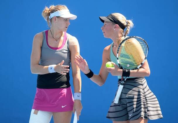 (140116) -- MELBOURNE, Jan. 16, 2014 (Xinhua) -- Andrea Hlavackova (R) and Lucie Safarova of Czech Republic react during their women s doubles 1st round match at 2014 Australian Open tennis tournament in Melbourne, Australia, Jan. 16, 2014. 
